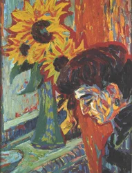 Tête de femme devant des tournesols